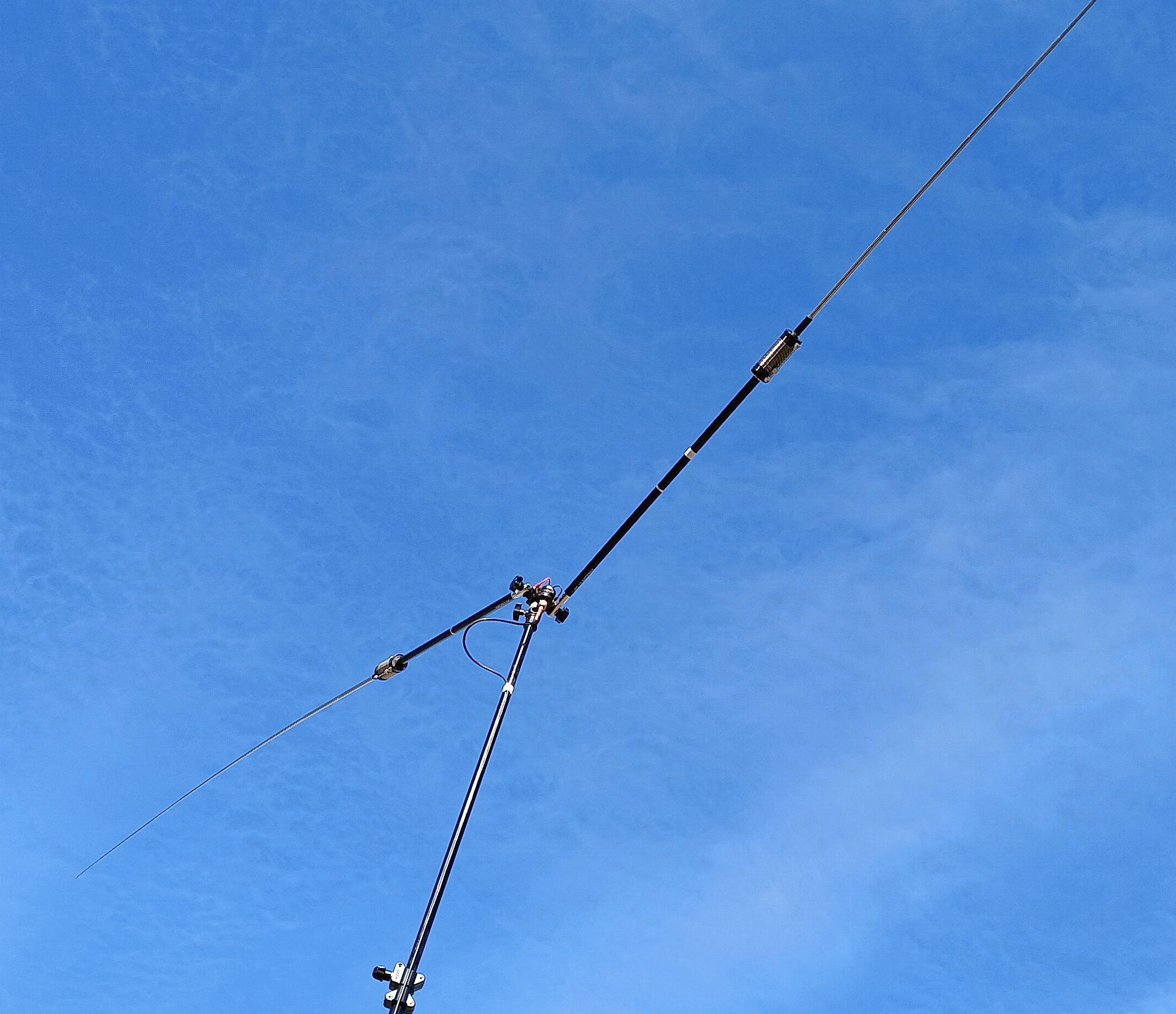Close-up of an antenna mast joint against the sky