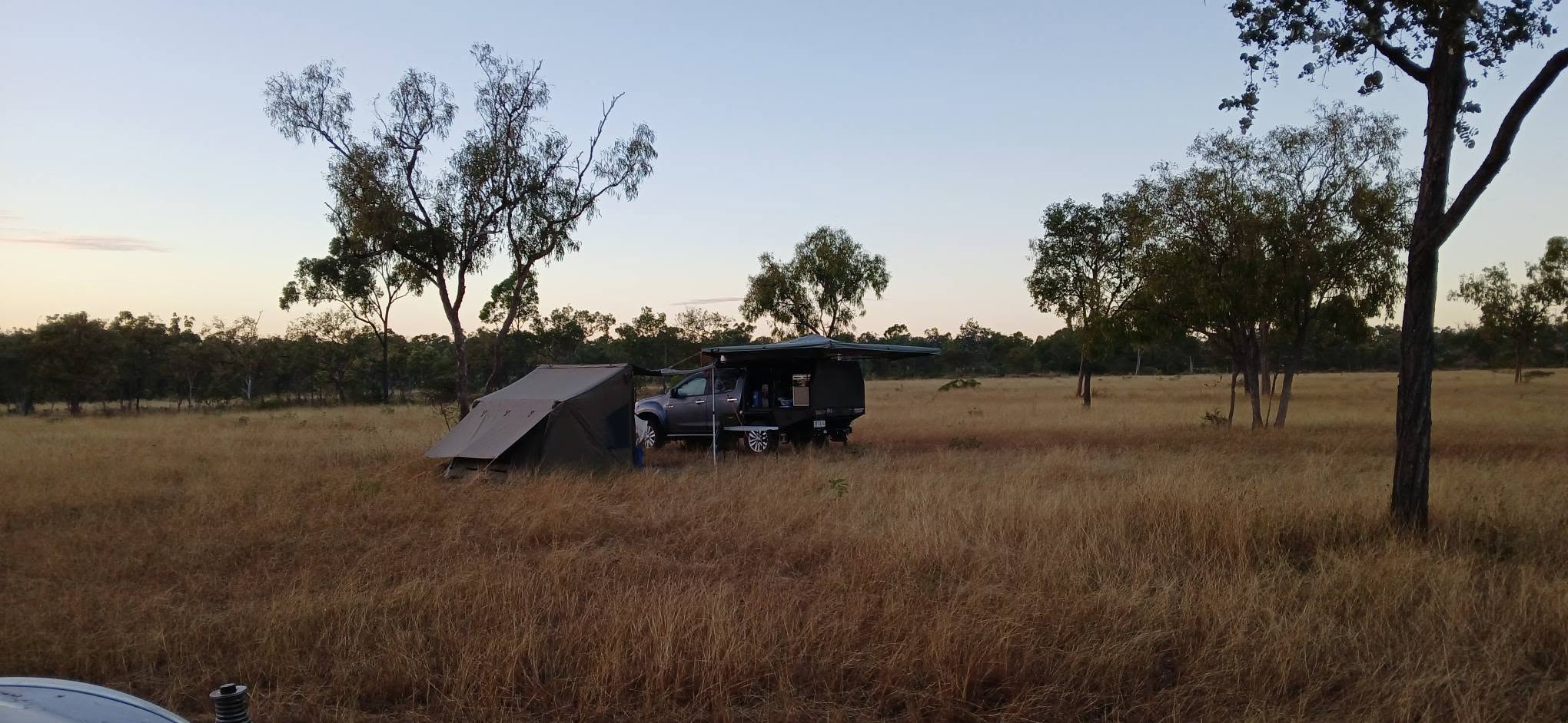 Tent and ute campsite at dusk