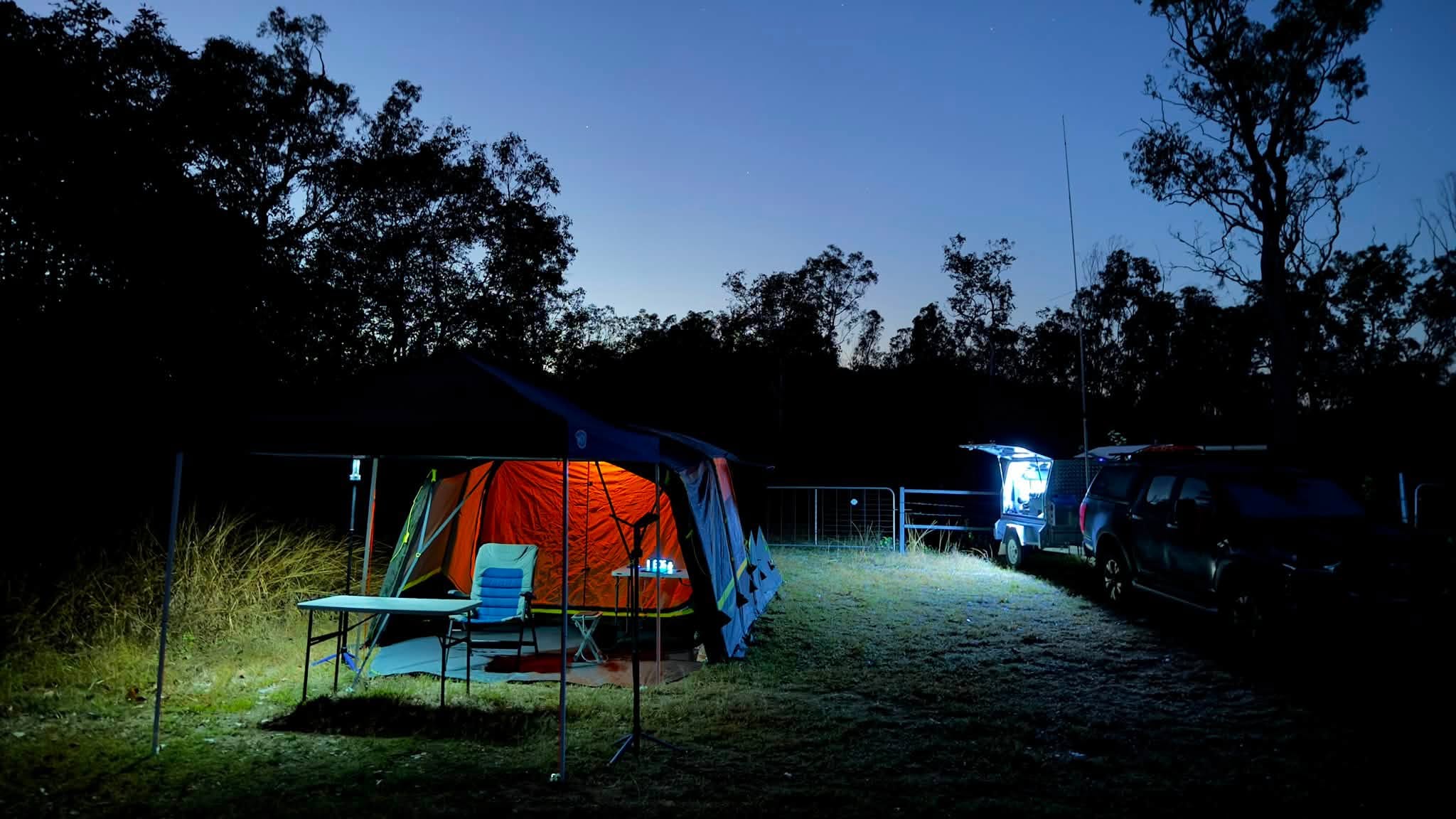 Checkpoint camp glowing at dusk