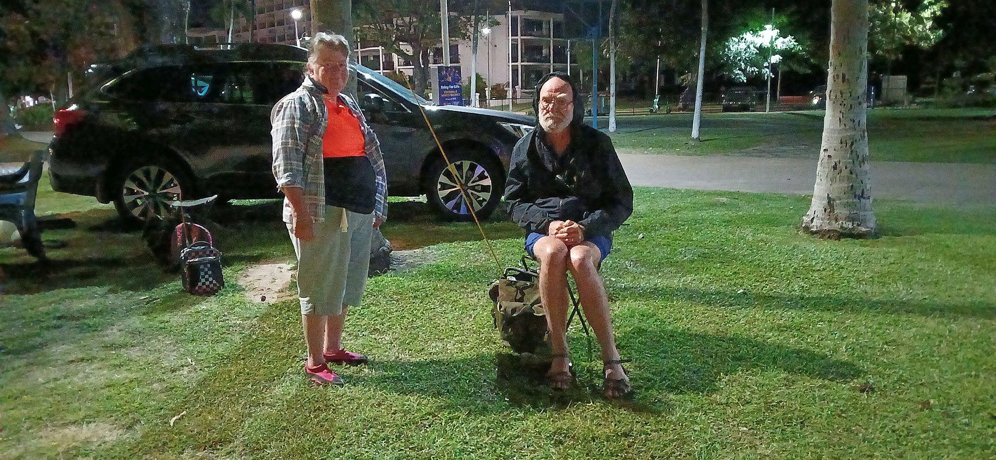 Operators setting up communications gear in the pre-dawn dark