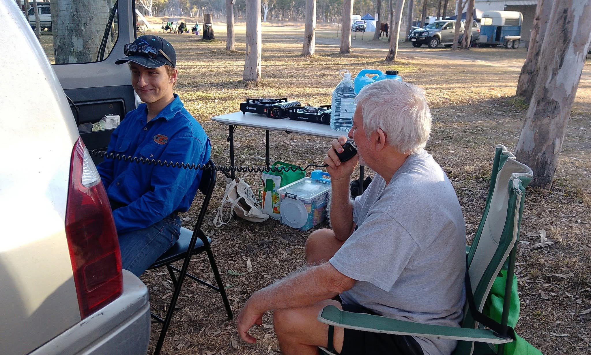 Two operators at a checkpoint, one on the radio mic