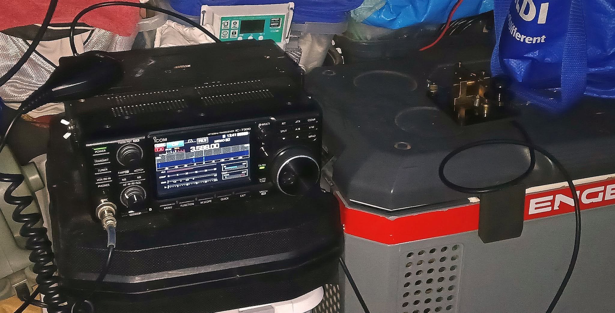 HF transceiver and Morse key set up on a portable fridge