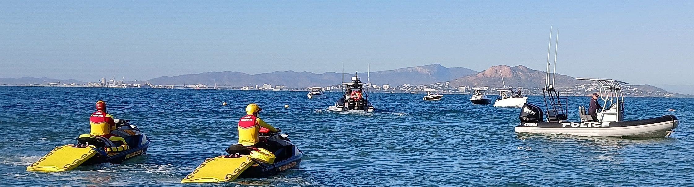 Safety fleet of rescue jet skis and a Police IRB out on the bay