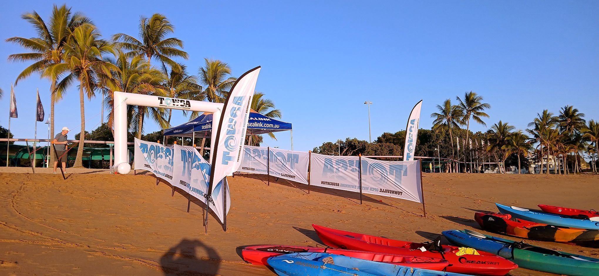 The TOWSA finish arch on Strand beach with kayaks lined up ready