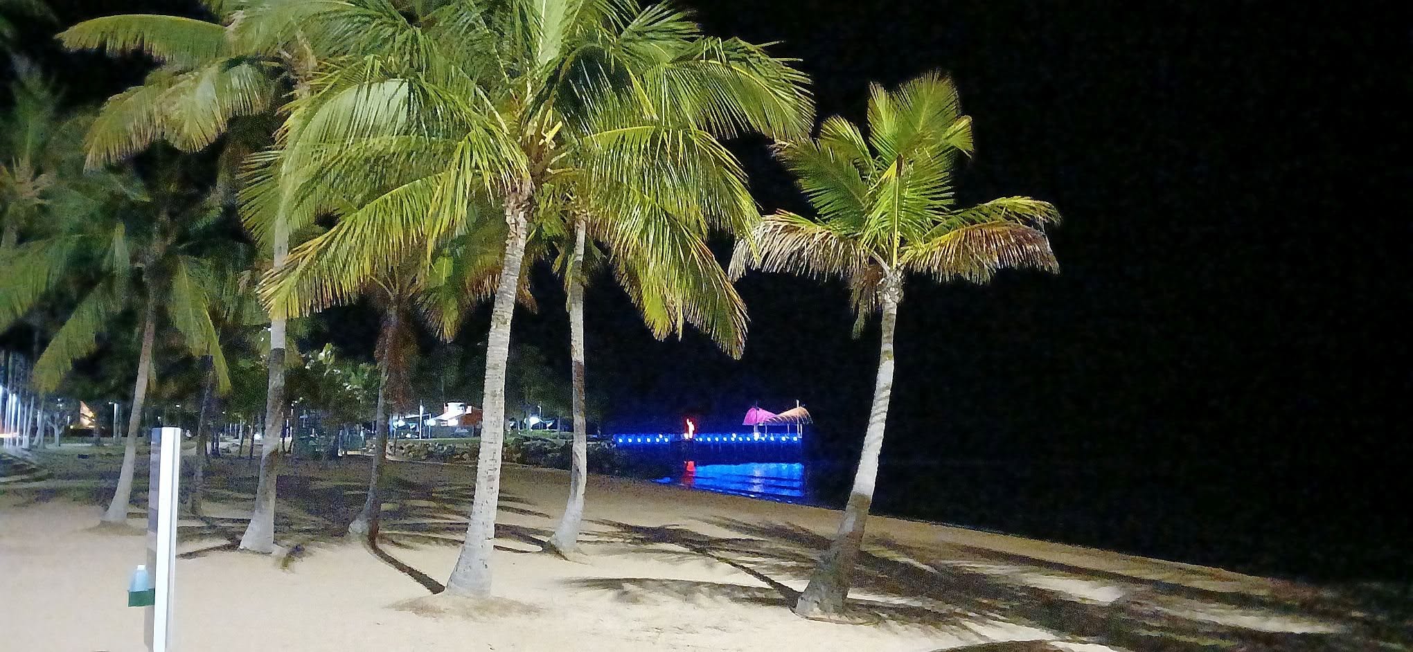 Pre-dawn at the Strand with the illuminated jellyfish sculpture across the water